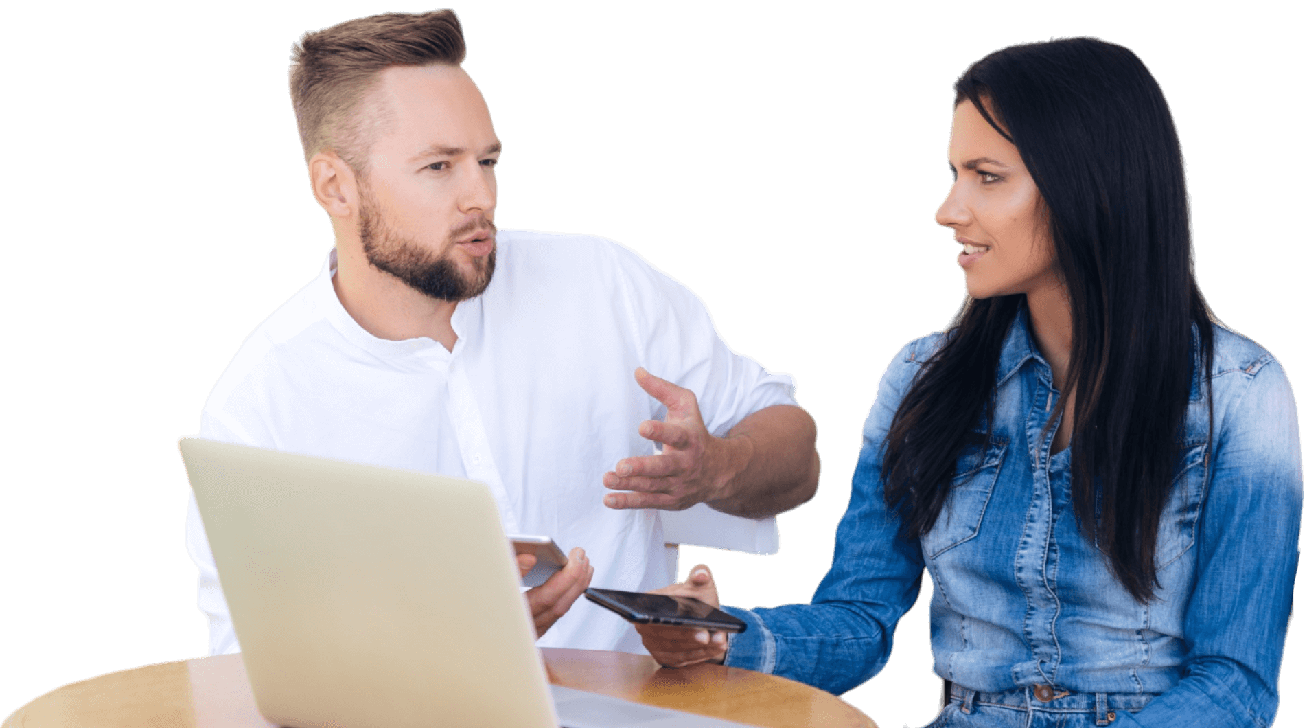 A man and woman are talking to each other while sitting at a table with a laptop, featuring Choose My Site Digital Marketing and aligning with data-driven online marketing solutions.
